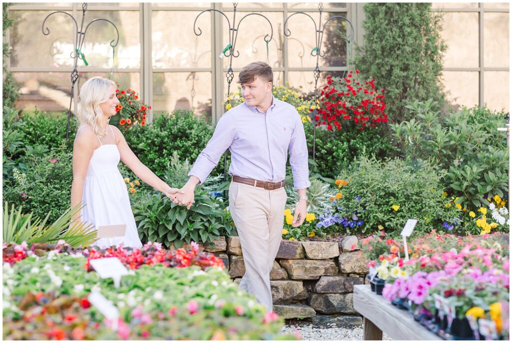 Couple strolling through garden shop at Botanic in Opelika | Alabama Wedding Photographer Amanda Horne