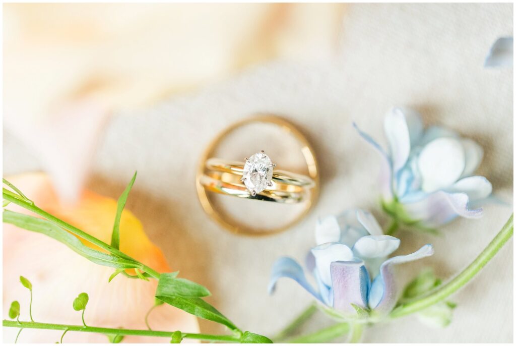 Wedding rings surrounded by vibrant florals  | Alabama wedding photographer Amanda Horne