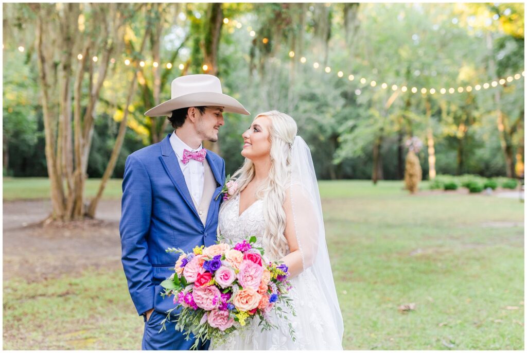 Bride and groom under fairy lights and Spanish moss | Central Alabama Wedding Photographer Amanda Horne