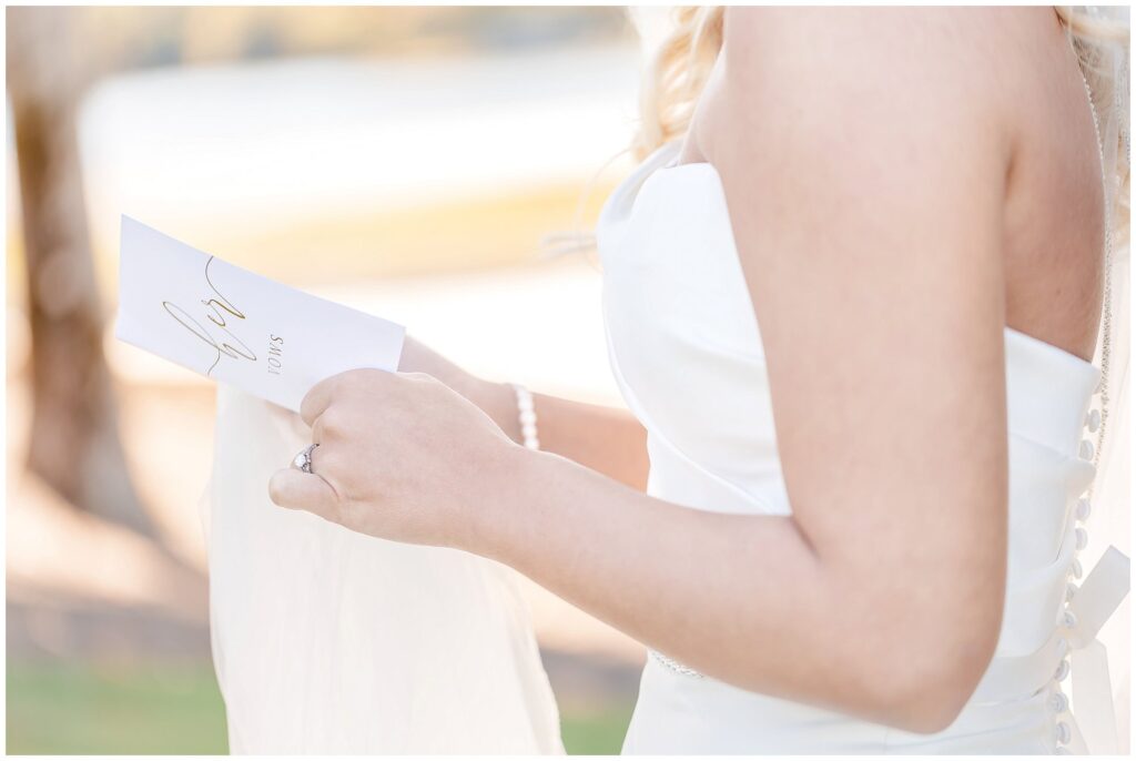 Bride's hands holding wedding vow book | Lake Martin Wedding Photographer Amanda Horne