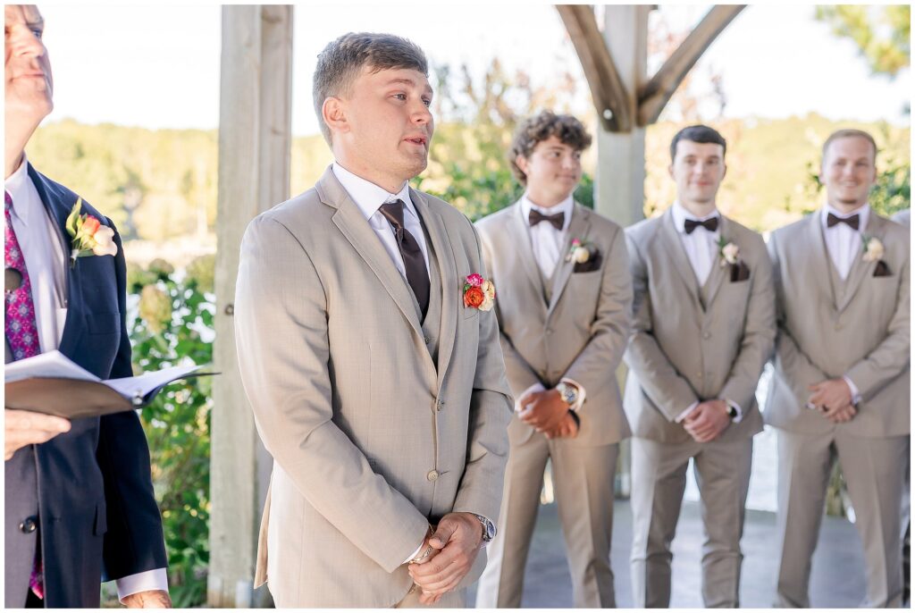 Groom watching bride walk down the aisle | Lake Martin Wedding Photographer Amanda Horne