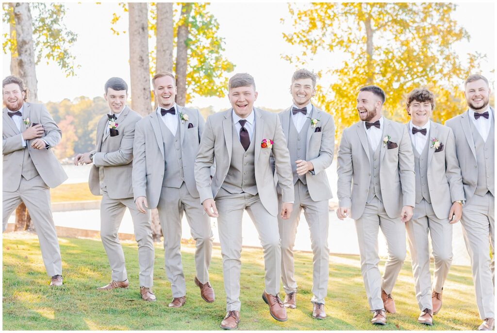 Laughing groom with groomsmen at New Water Farms | Lake Martin Wedding Photographer Amanda Horne