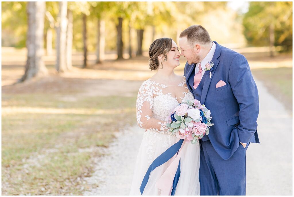 December Bride and groom with blue and pink accents | Alabama Wedding Photographer Amanda Horne