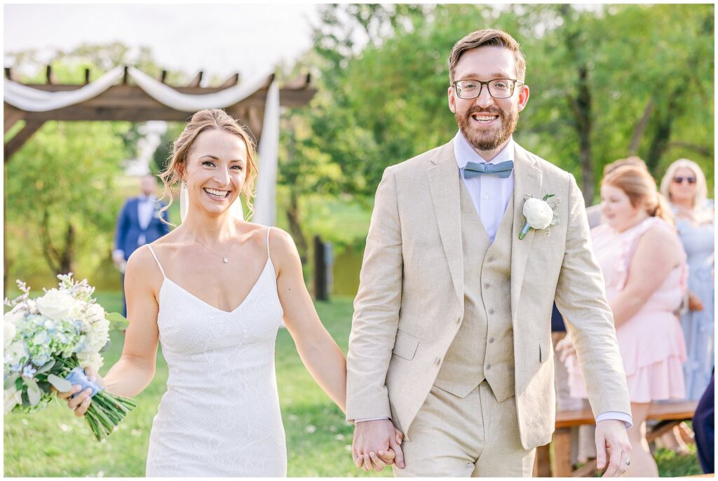 Bride and groom smiling together after ceremony at The Farm at Lullwater