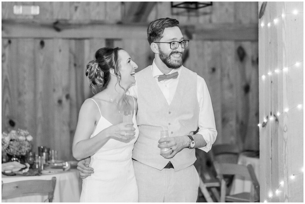 Couple sharing a laugh during speeches