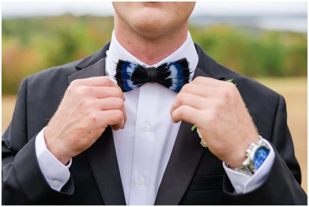 Groom adjusting bowtie | Wedding Photography by Amanda Horne