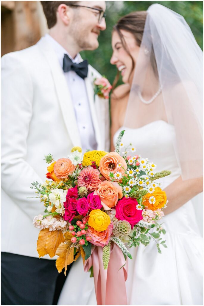 Laughing bride and groom on their wedding day, wedding trends worth keeping