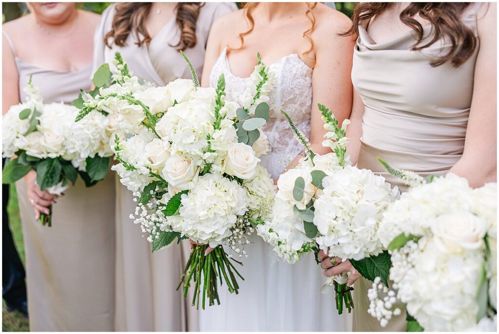 Bride and bridesmaids with bouquets at her Oakhurst wedding


